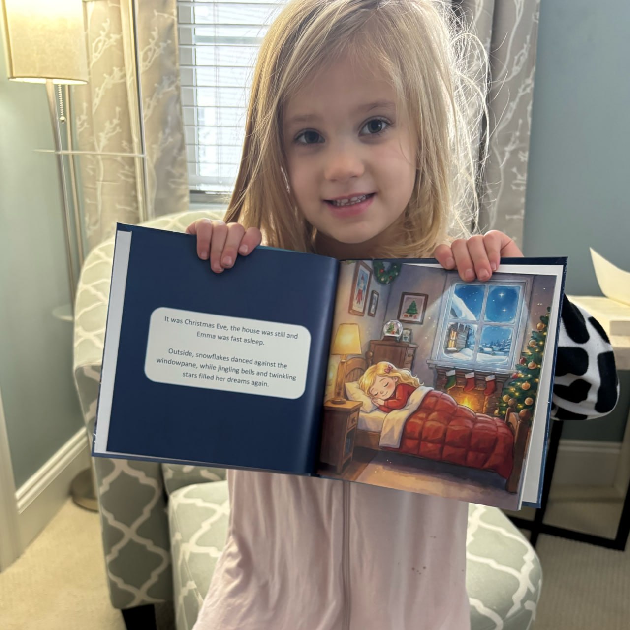 Child holding their personalized hardcover book